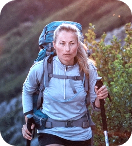 Woman hiking wearing backpack