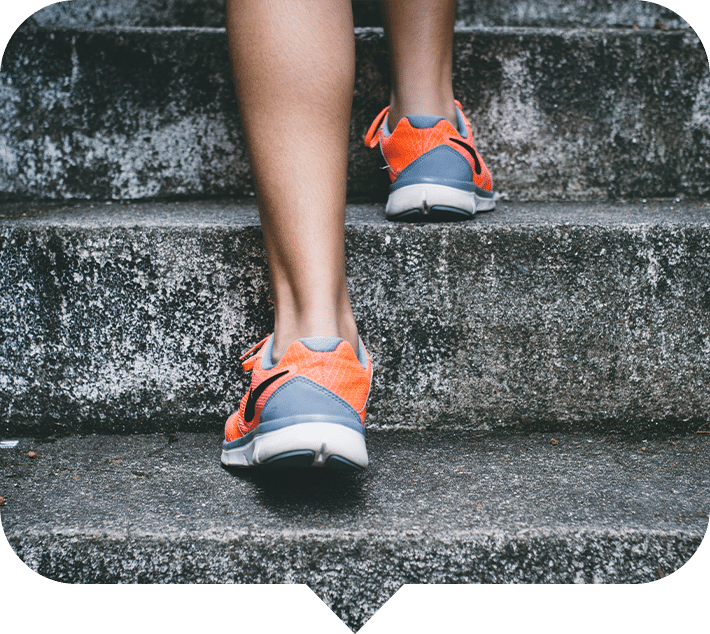 closeup of feet going up stairs