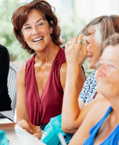 women laughing at womens retreat kickoff meeting