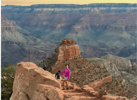 hiker on steps of Grand Canyon