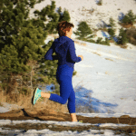 midlife woman running in mountains