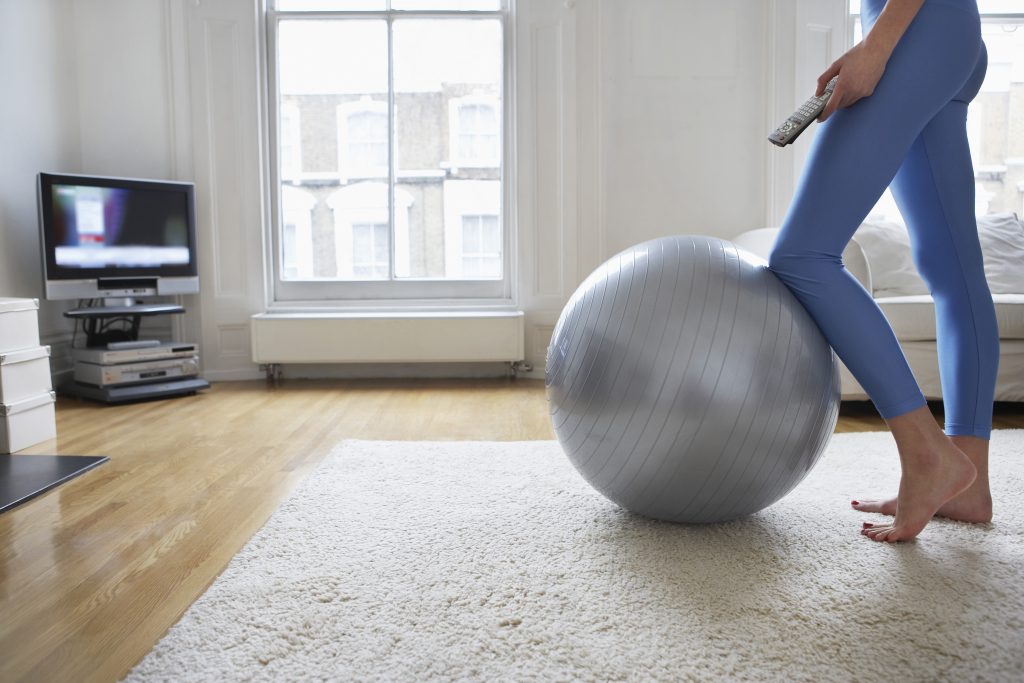 Woman Exercising with Television