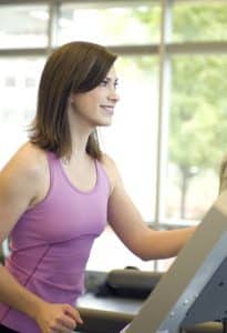 woman exercising on treadmill